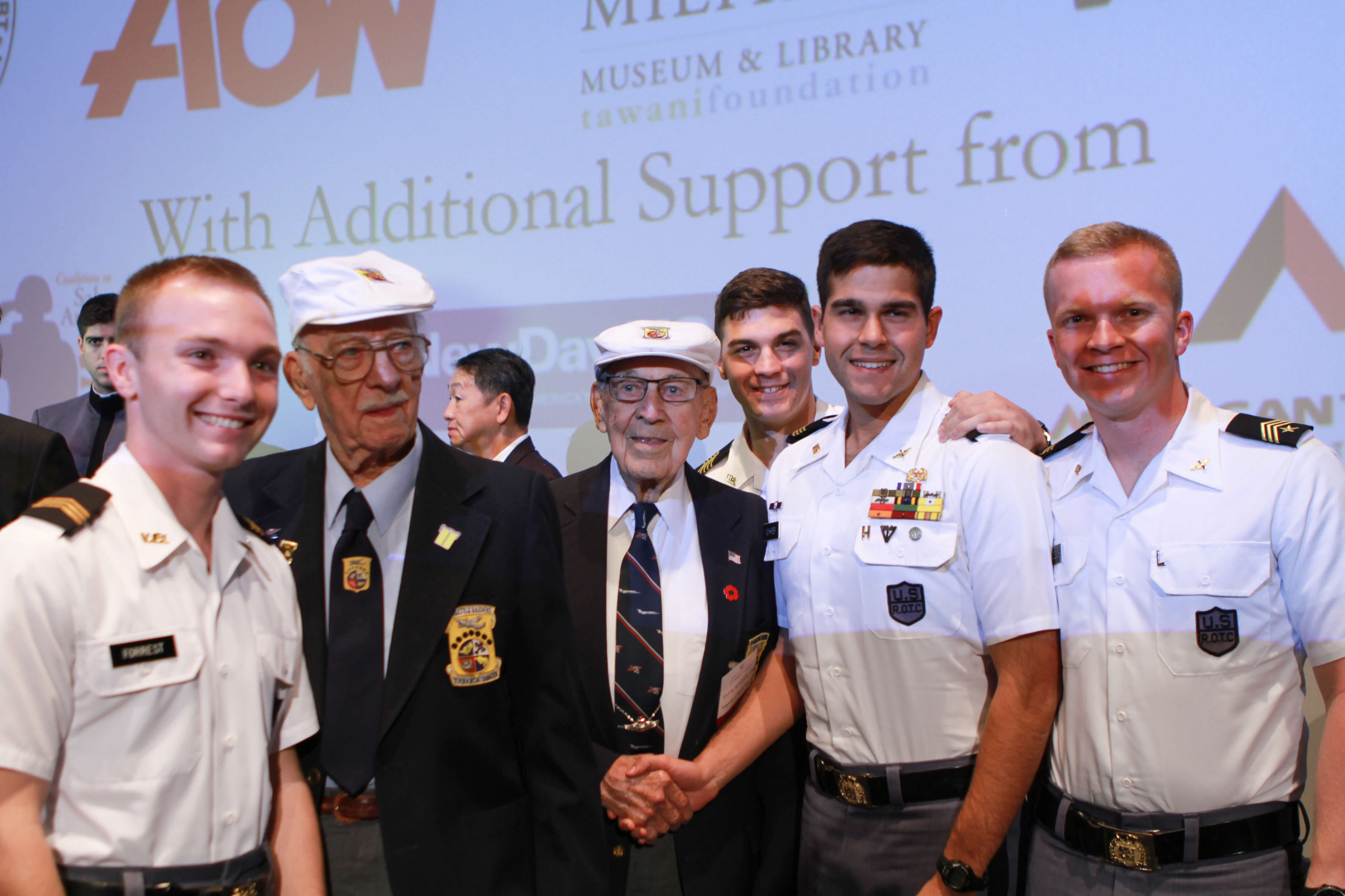 Doolittle Raiders LTC Edward Saylor and LTC Richard Cole pose with conference attendees.