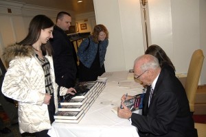 General Dave Palmer signs his book for guests at the 2009 Andrew J. Goodpaster Prize and Lecture. 